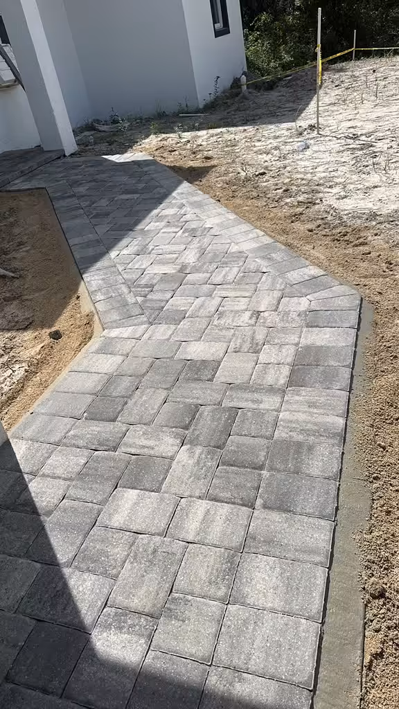 Herringbone paver walkway installation
